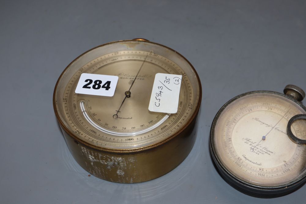 A Short & Mason surveying aneroid precision barometer and a P. Casartelli aneroid barometer, diameter 8cm & 12cm
